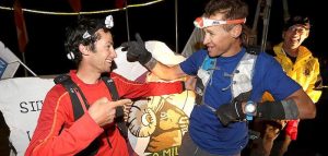 Kilian Jornet and Jason Schlarb winning the Hardrock 100 race together, both using Petzl headlamps.