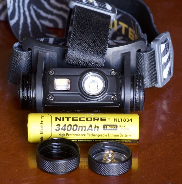 NiteCore HC65, battery, strap, and end caps from retail box.